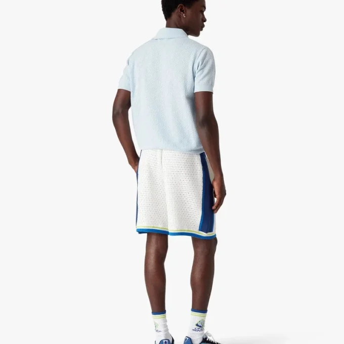 Blauw Pointelle Monogram poloshirt met korte mouwen Blauw Pointelle Monogram poloshirt met korte mouwen