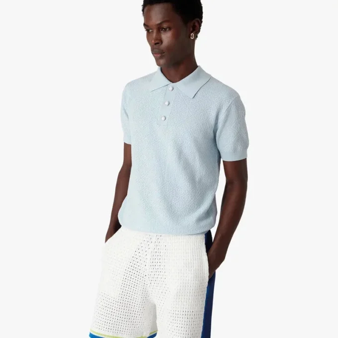 Blauw Pointelle Monogram poloshirt met korte mouwen Blauw Pointelle Monogram poloshirt met korte mouwen