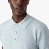 Blauw Pointelle Monogram poloshirt met korte mouwen Blauw Pointelle Monogram poloshirt met korte mouwen
