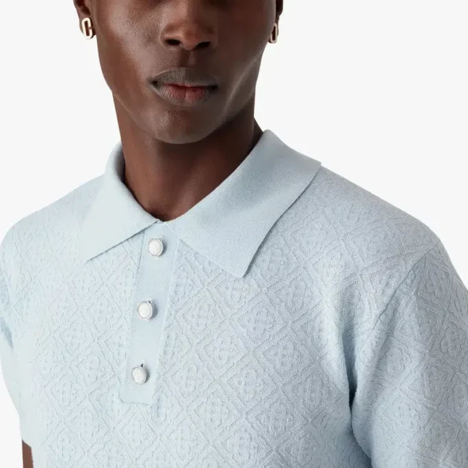 Blauw Pointelle Monogram poloshirt met korte mouwen Blauw Pointelle Monogram poloshirt met korte mouwen
